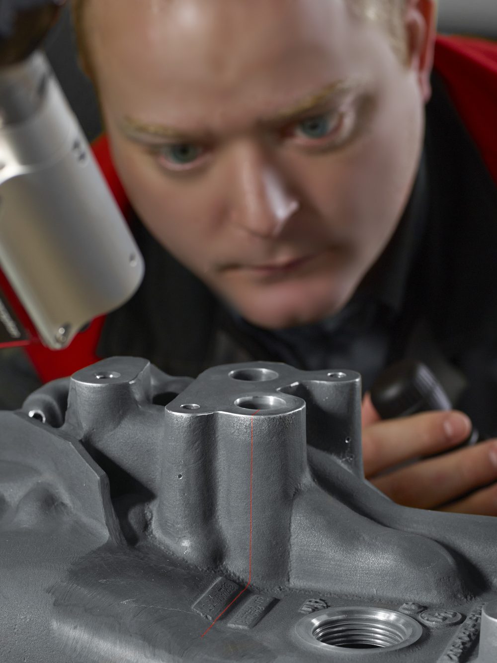 Laser scanning a cast part at Made to Measure — scan line visible on the surface