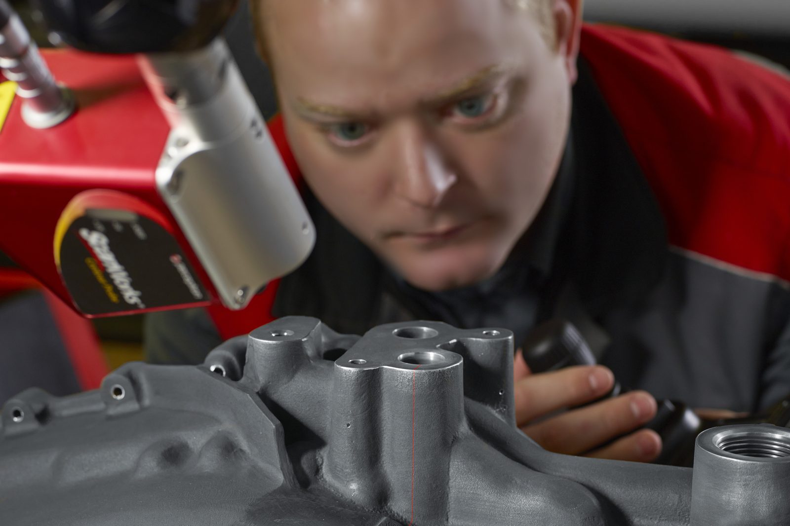Laser scanning a cast part at Made to Measure — scan line visible on the surface