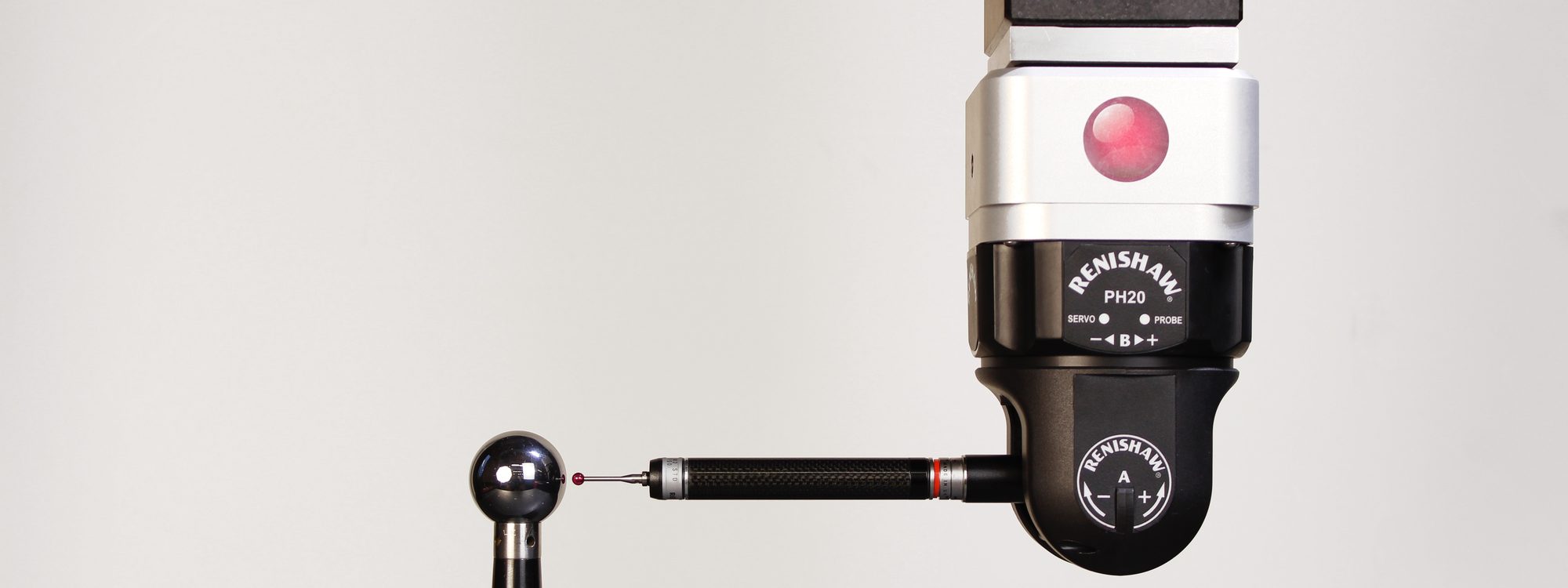 Renishaw PH20 5-axis probe head verifying against a calibration datum sphere